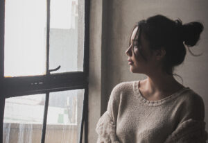 Woman looking out a window