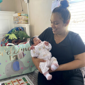 A mother holds her baby.
