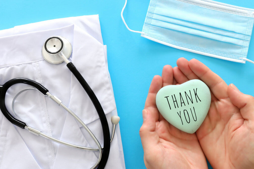 medical supplies and hands saying thank you