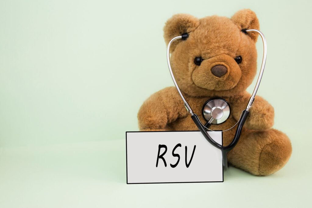 teddy bear with stethoscope and RSV card