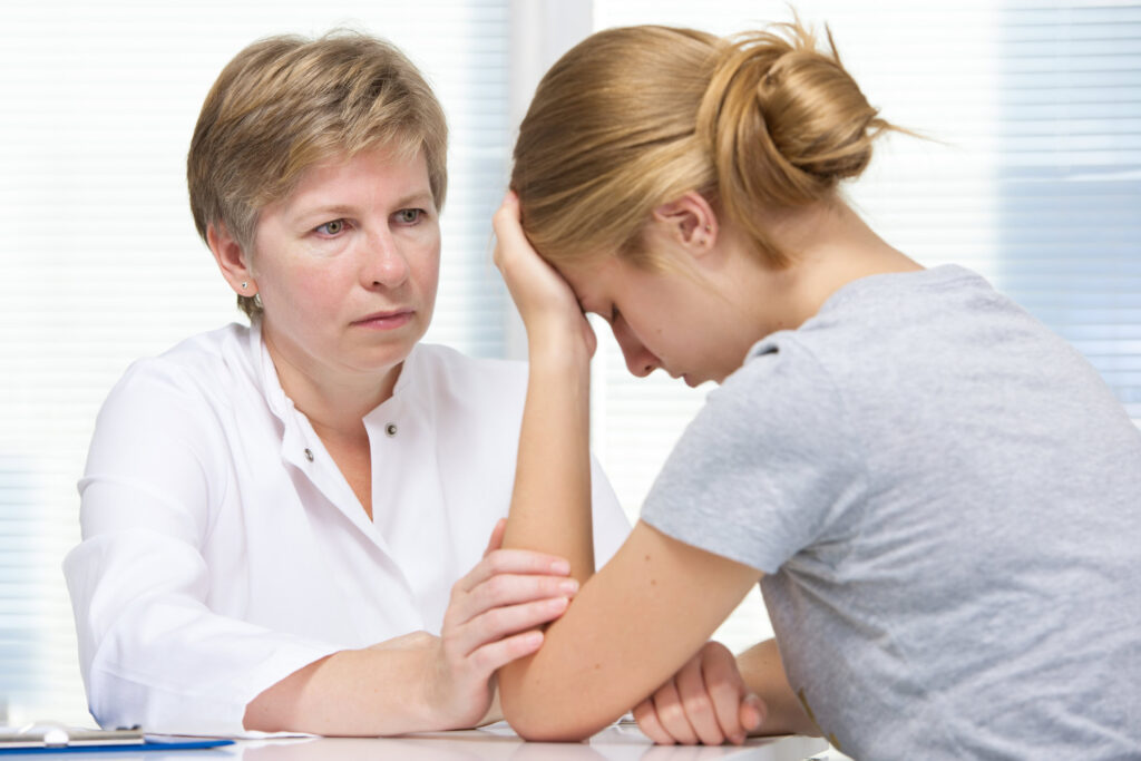 mother talks to her troubled daughter