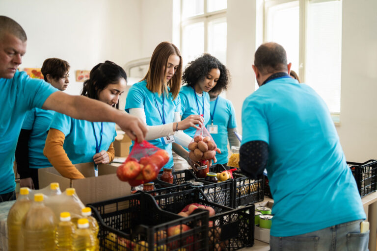 volunteers packing boxes at a foodbank